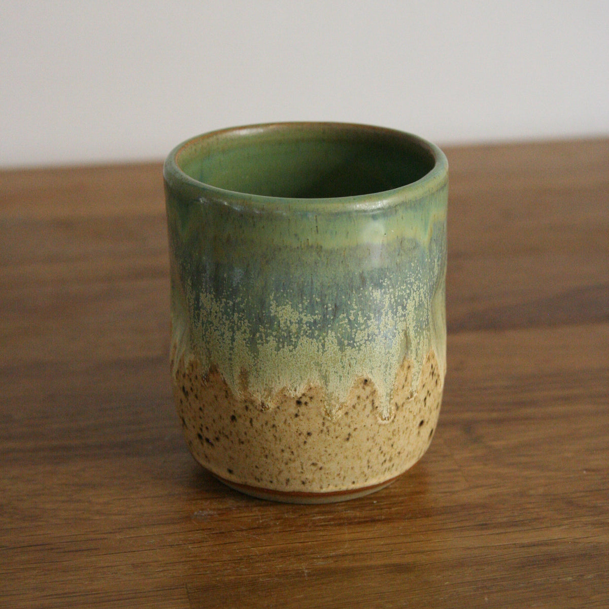 Handmade Woodland glaze thumb cup, thrown stoneware pottery by Emma Kathryn Pottery