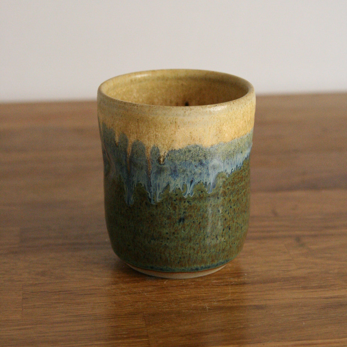 Handmade Rocky Hillside glaze thumb cup, thrown stoneware pottery by Emma Kathryn Pottery